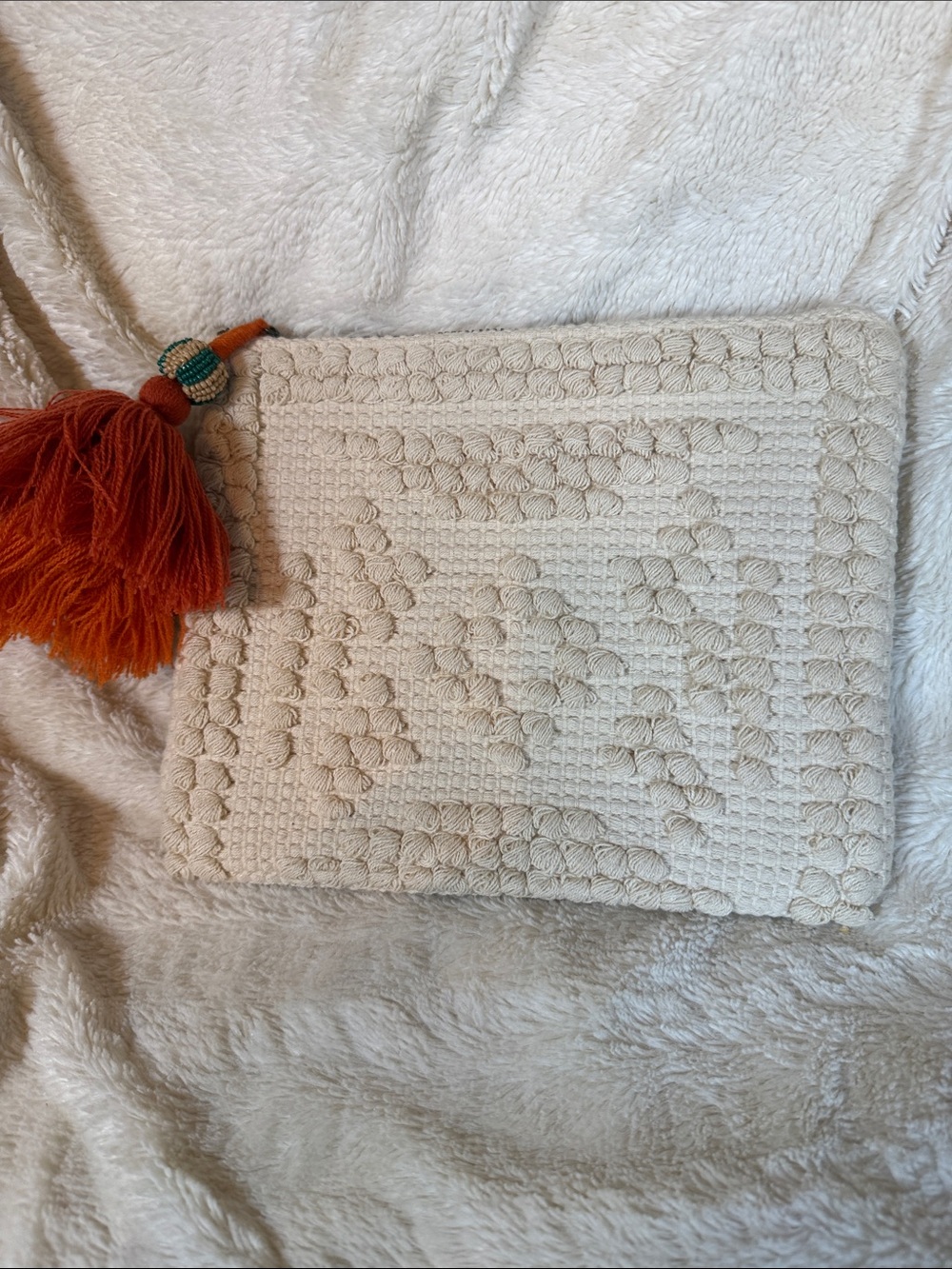 Universal Thread Cream Macramé Clutch with Orange Tassel Accent